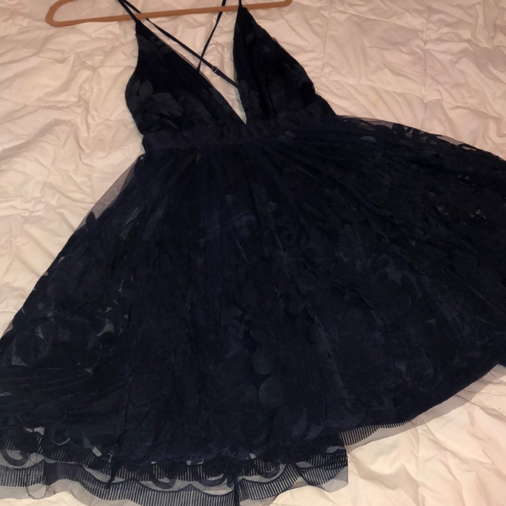 Navy blue floral dress with straps. Plunge neck.